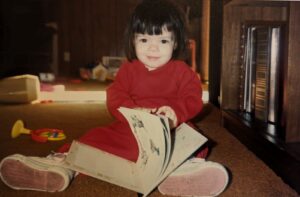Baby flipping through books 