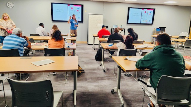 classroom with adult english language learners