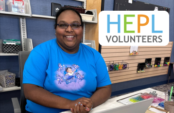 woman in blue shirt smiling