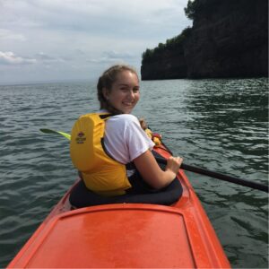 woman in red kayak