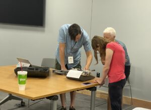 3 people troubleshooting technology