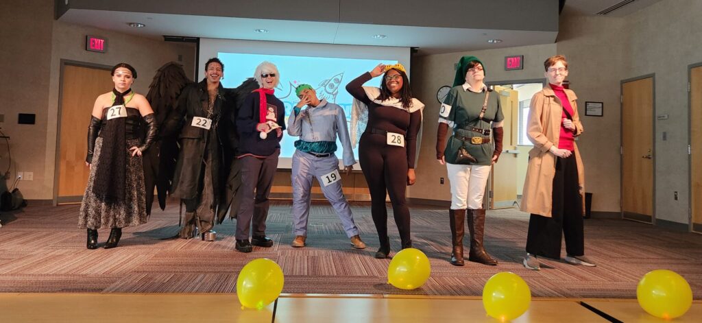 group of people in cosplay on a stage