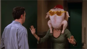 Woman with turkey on her head, scene from Friends episode