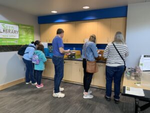 several people browsing through seed library catalog