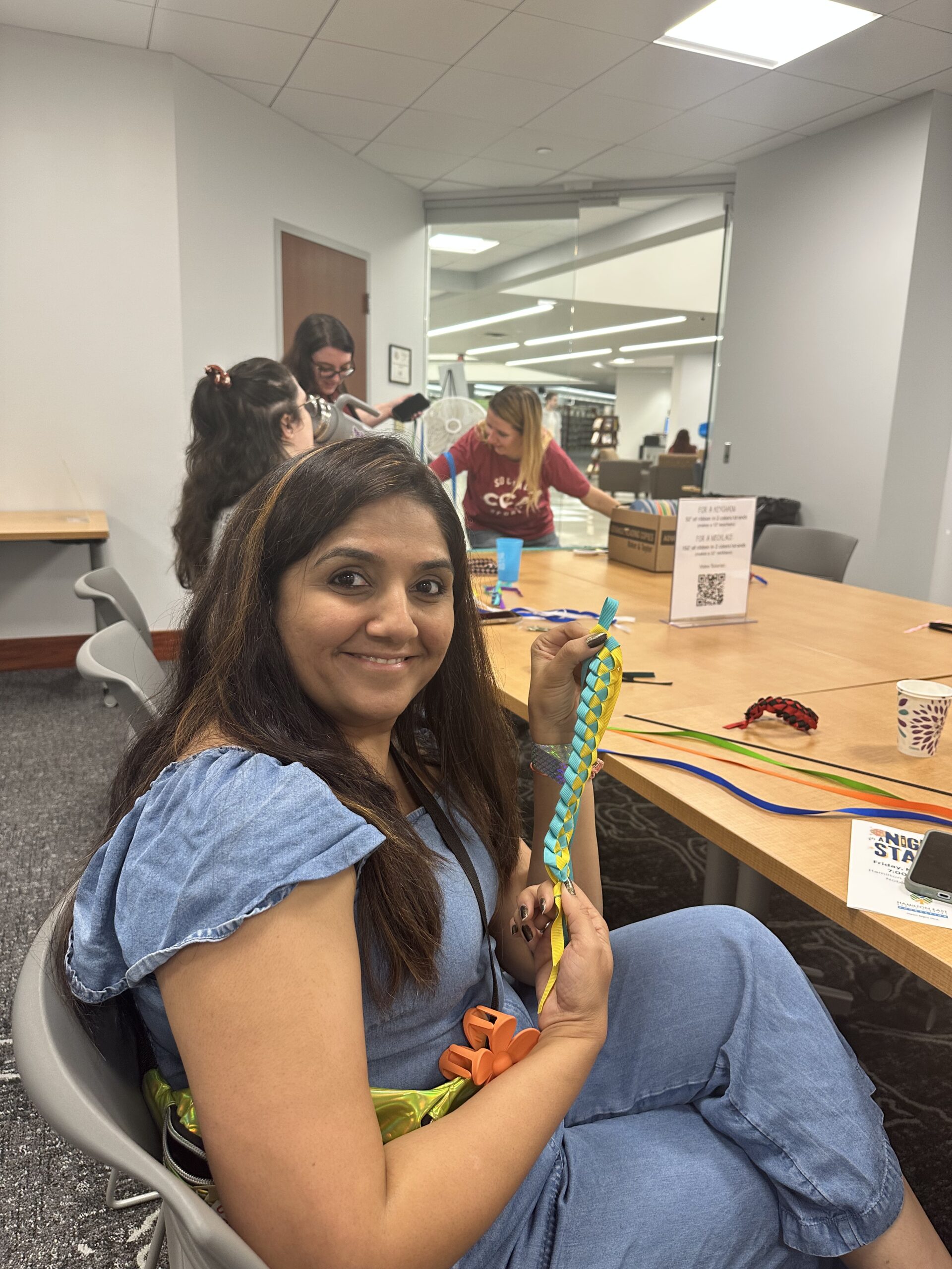 Woman showing off her craft project