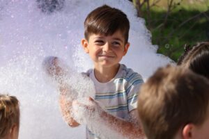 boy in foam bubbles