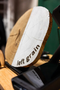 wooden circle with "left grain" engraved into it
