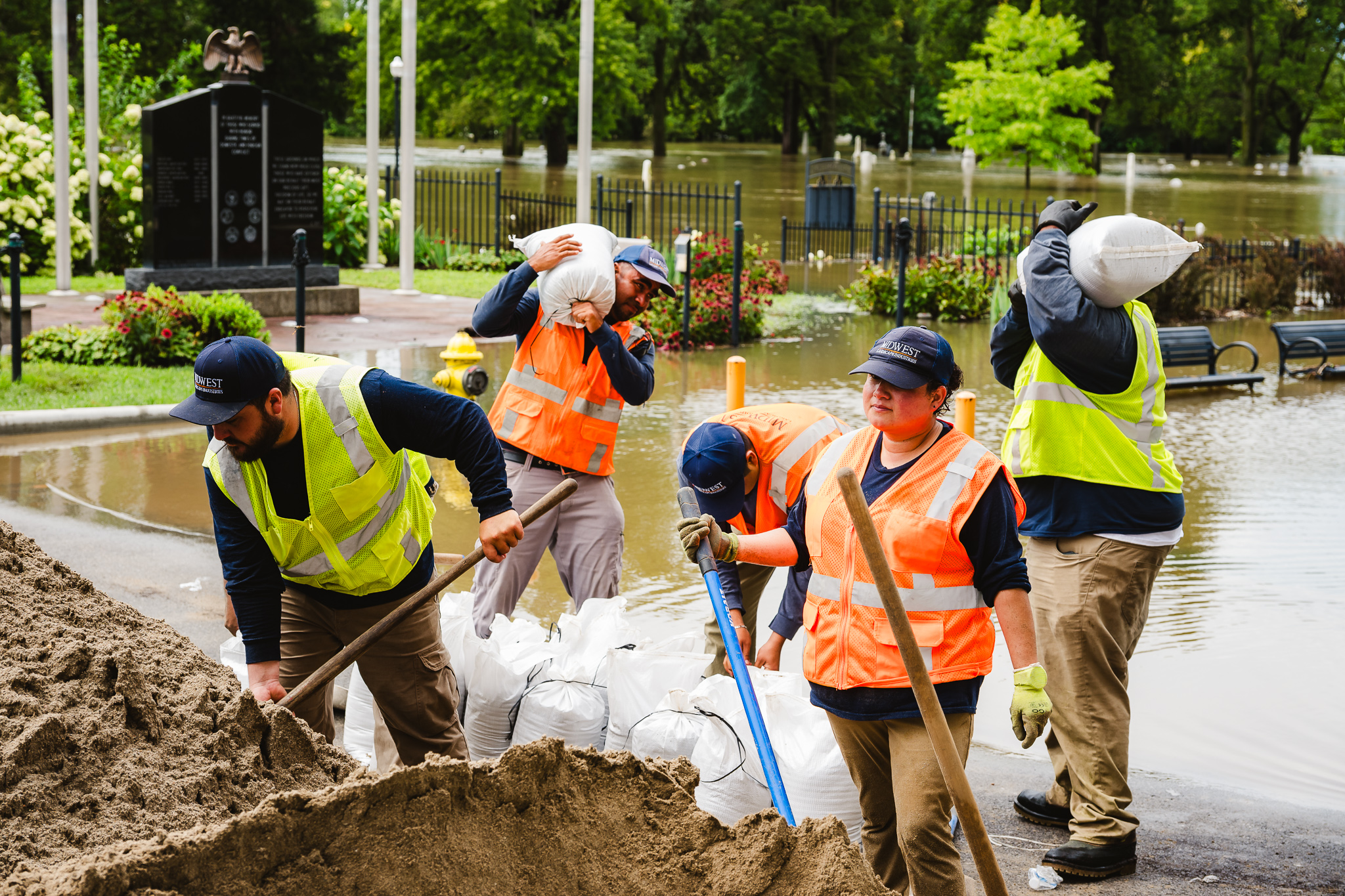 photo of crew of people working to lear out flood damage